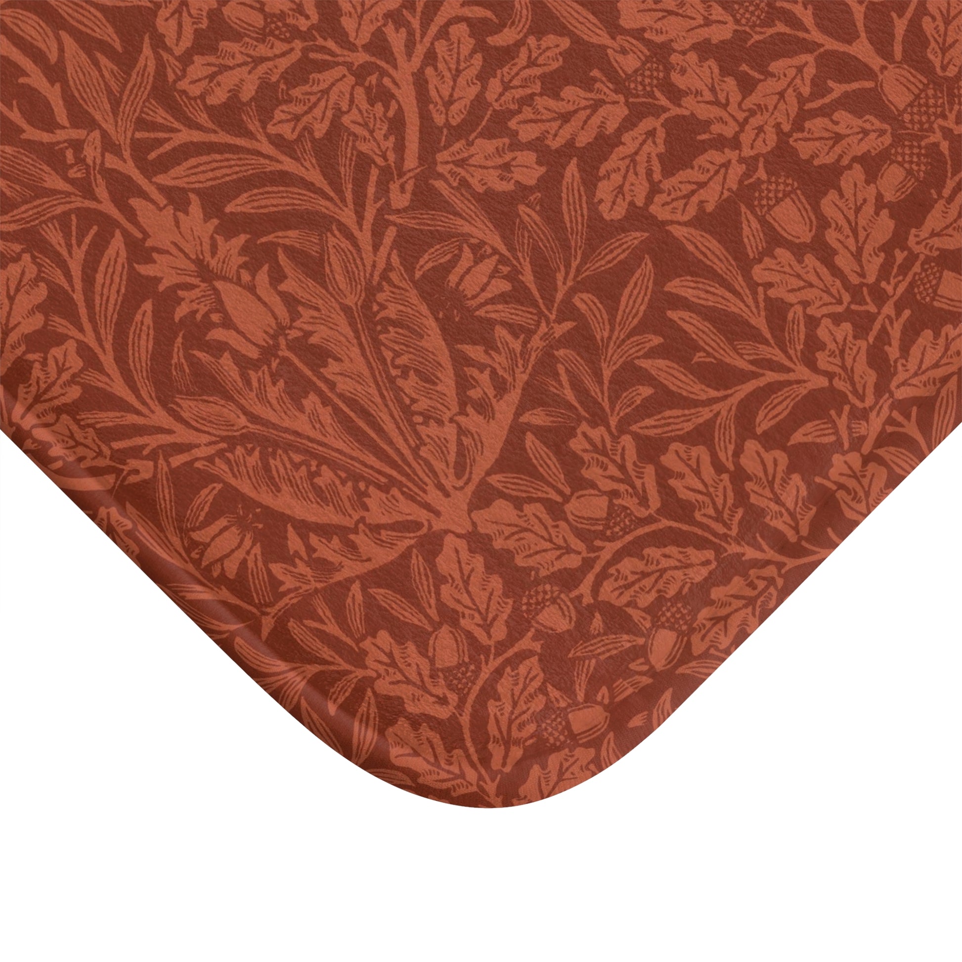 Rectangular microfibre bath mat in a rust colour with a floral pattern inspired by William Morris.