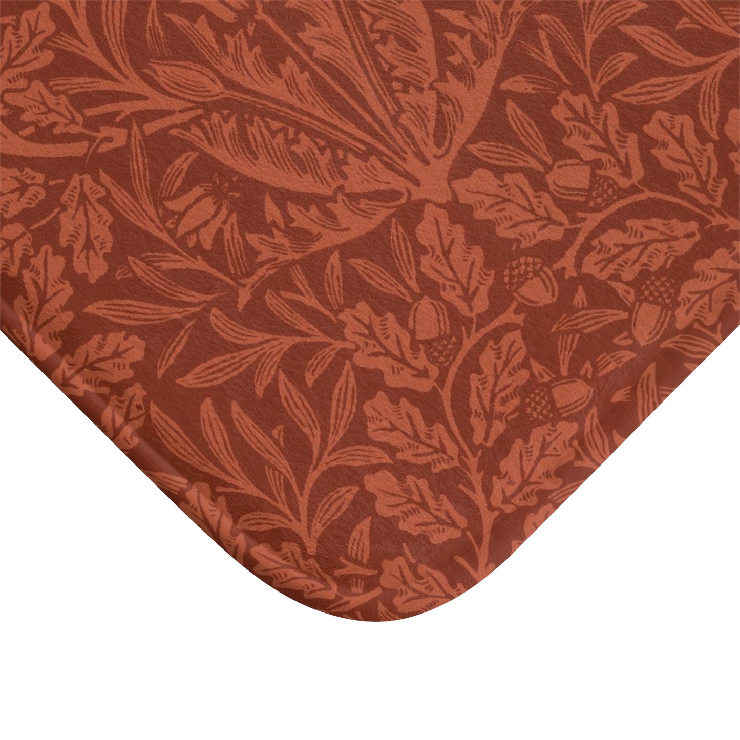 Rectangular microfibre bath mat in a rust colour with a floral pattern inspired by William Morris.