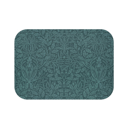 A rectangular microfibre bath mat in teal colour, featuring a floral pattern inspired by William Morris.