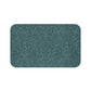 A rectangular microfibre bath mat in teal color, featuring a floral pattern inspired by William Morris.