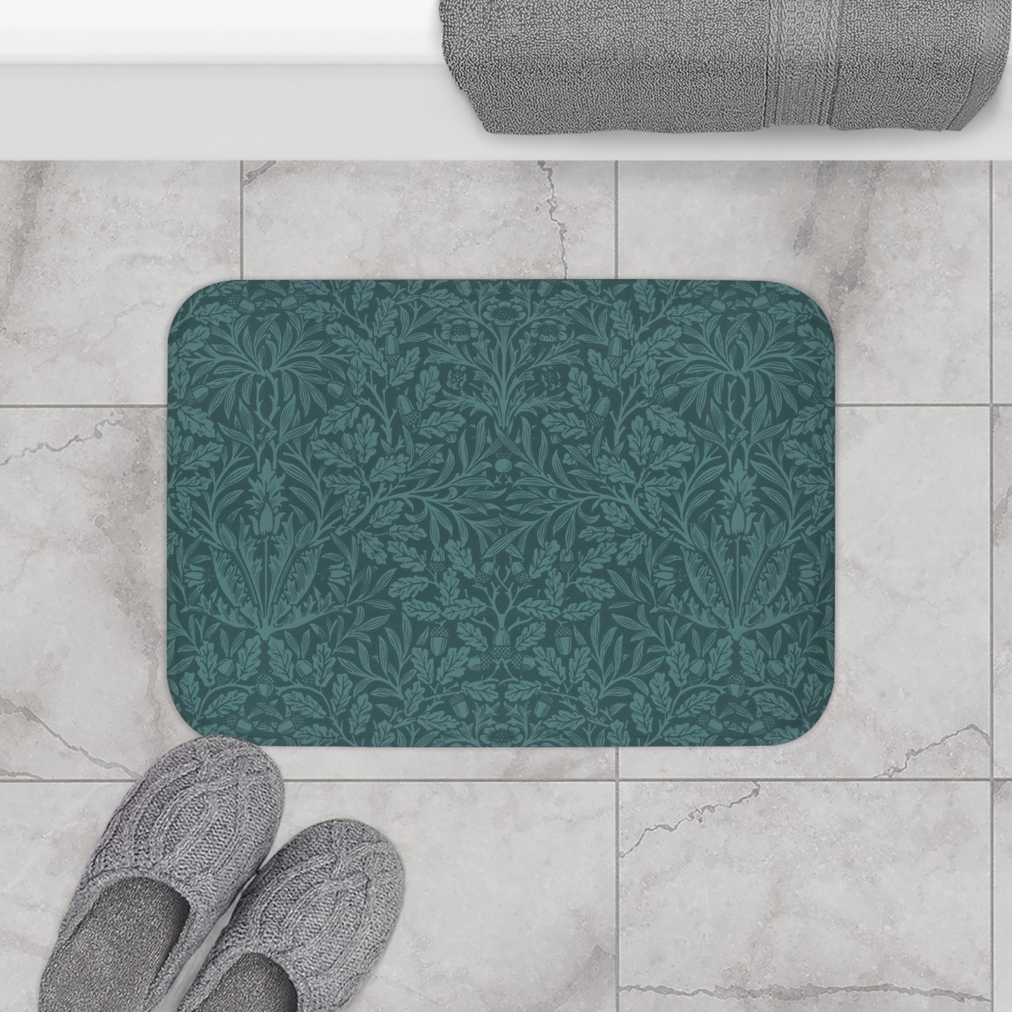A rectangular microfibre bath mat in teal colour, featuring a floral pattern inspired by William Morris.