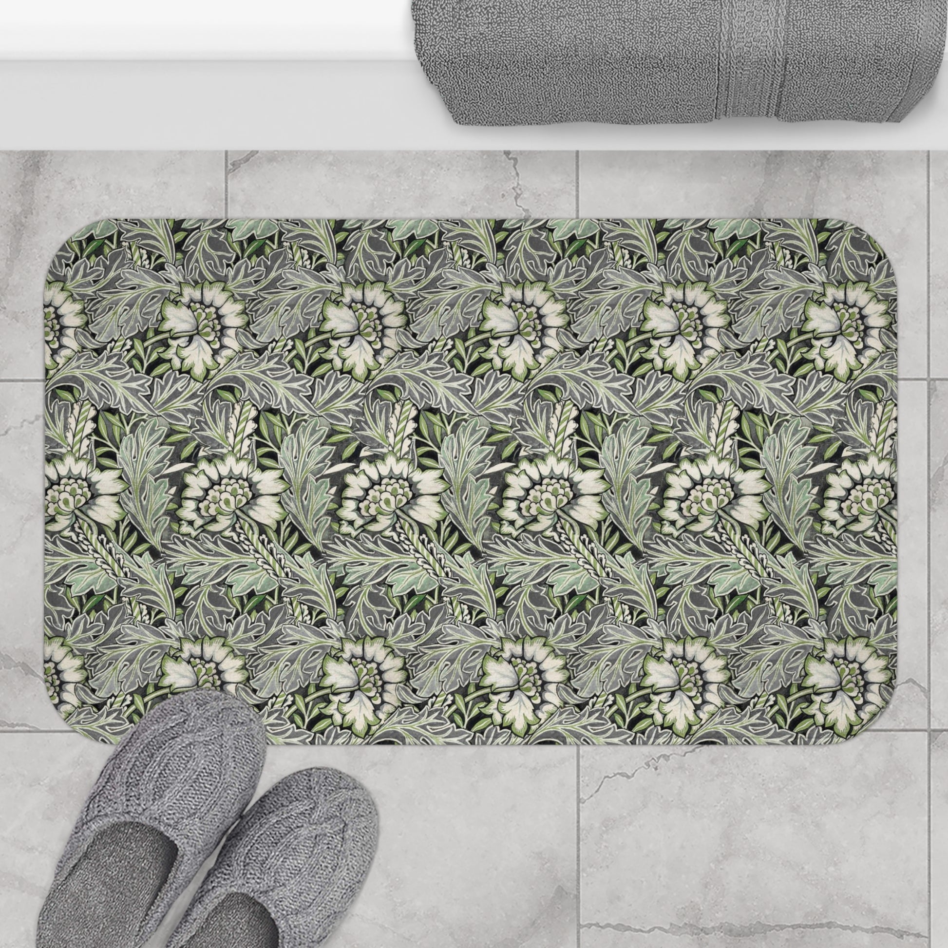 Microfibre bath mat with a floral pattern inspired by William Morris, predominantly grey in colour.