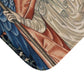 A microfibre bath mat with a printed design featuring two angels from the William Morris Angeli Ministrantes collection.