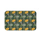 Microfibre bath mat with a floral pattern inspired by William Morris, predominantly yellow flowers on a green background with a non-slip border.