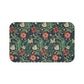 Rectangular microfibre bath mat with a floral pattern inspired by William Morris, in colors green, red, and beige.