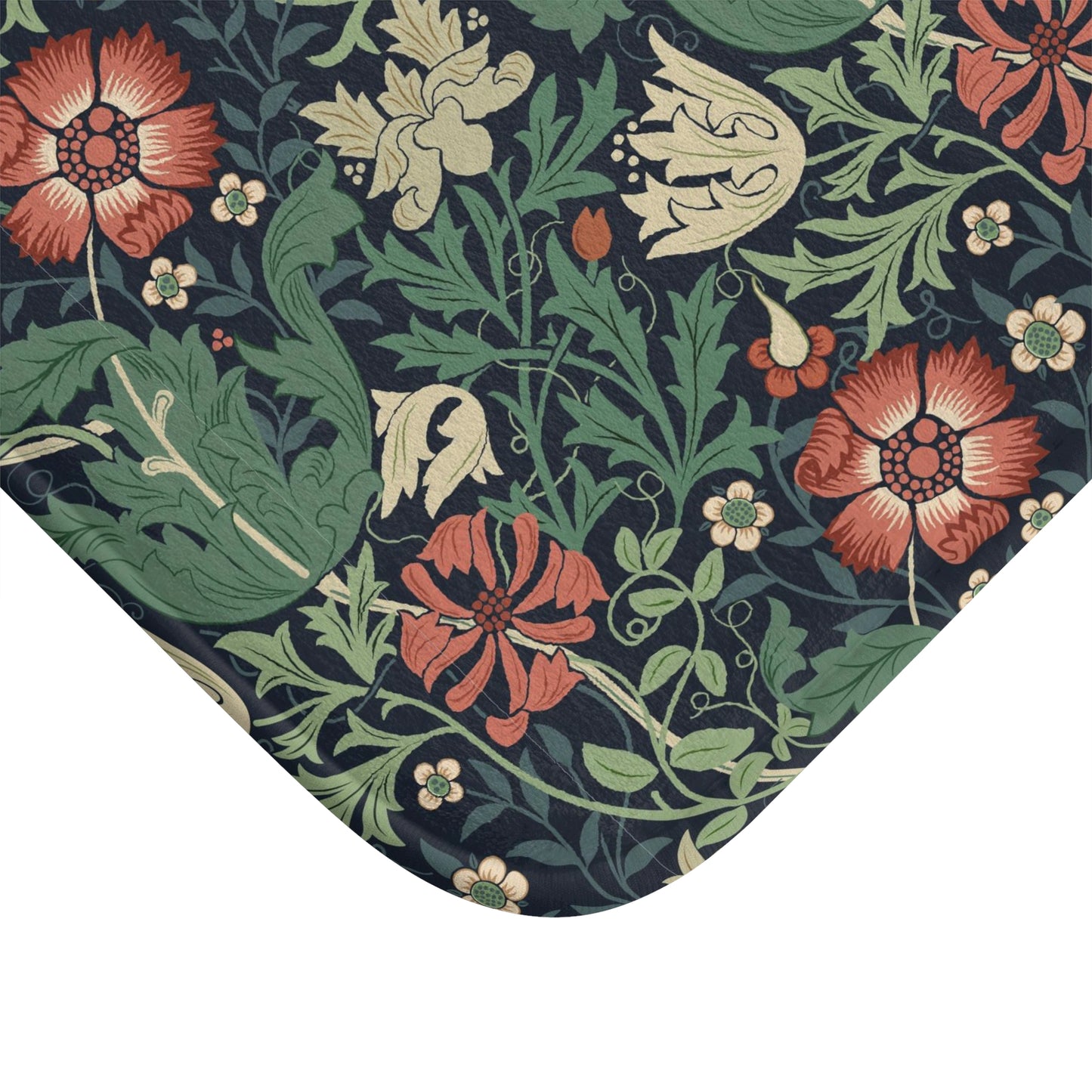 Rectangular microfibre bath mat with a floral pattern inspired by William Morris, in colours green, red, and beige.