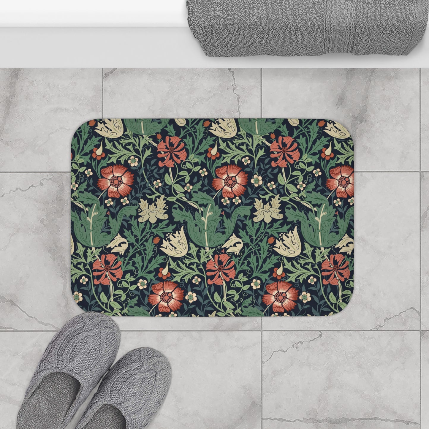Rectangular microfibre bath mat with a floral pattern inspired by William Morris, in colours green, red, and beige.