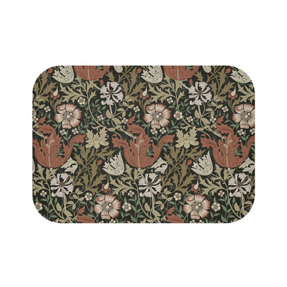 A rectangular microfibre bath mat with a floral pattern inspired by William Morris, in colours brown, beige, and green.