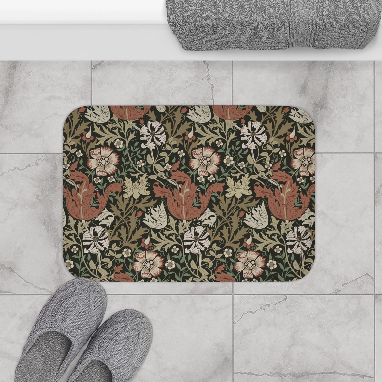 A rectangular microfibre bath mat with a floral pattern inspired by William Morris, in colours brown, beige, and green.