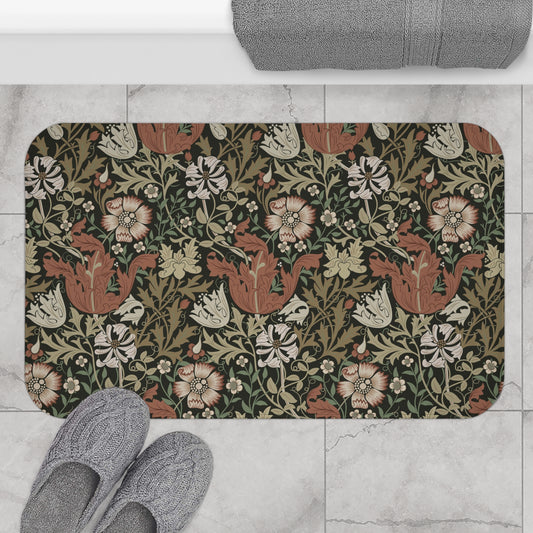 A rectangular microfibre bath mat with a floral pattern inspired by William Morris, in colours brown, beige, and green.