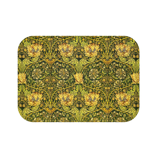 A round microfibre bath mat with a floral pattern in gold, brown, and green colors, inspired by William Morris - Honeysuckle Collection.