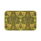 A round microfibre bath mat with a floral pattern in gold, brown, and green colours, inspired by William Morris - Honeysuckle Collection.