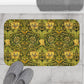 A round microfibre bath mat with a floral pattern in gold, brown, and green colours, inspired by William Morris - Honeysuckle Collection.