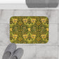 A round microfibre bath mat with a floral pattern in gold, brown, and green colours, inspired by William Morris - Honeysuckle Collection.