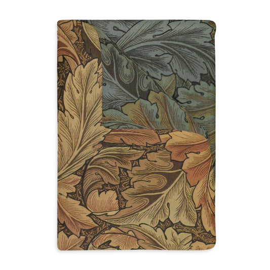 A luxury velveteen minky blanket with a two-sided print featuring intricate floral designs, primarily in brown and green shades.