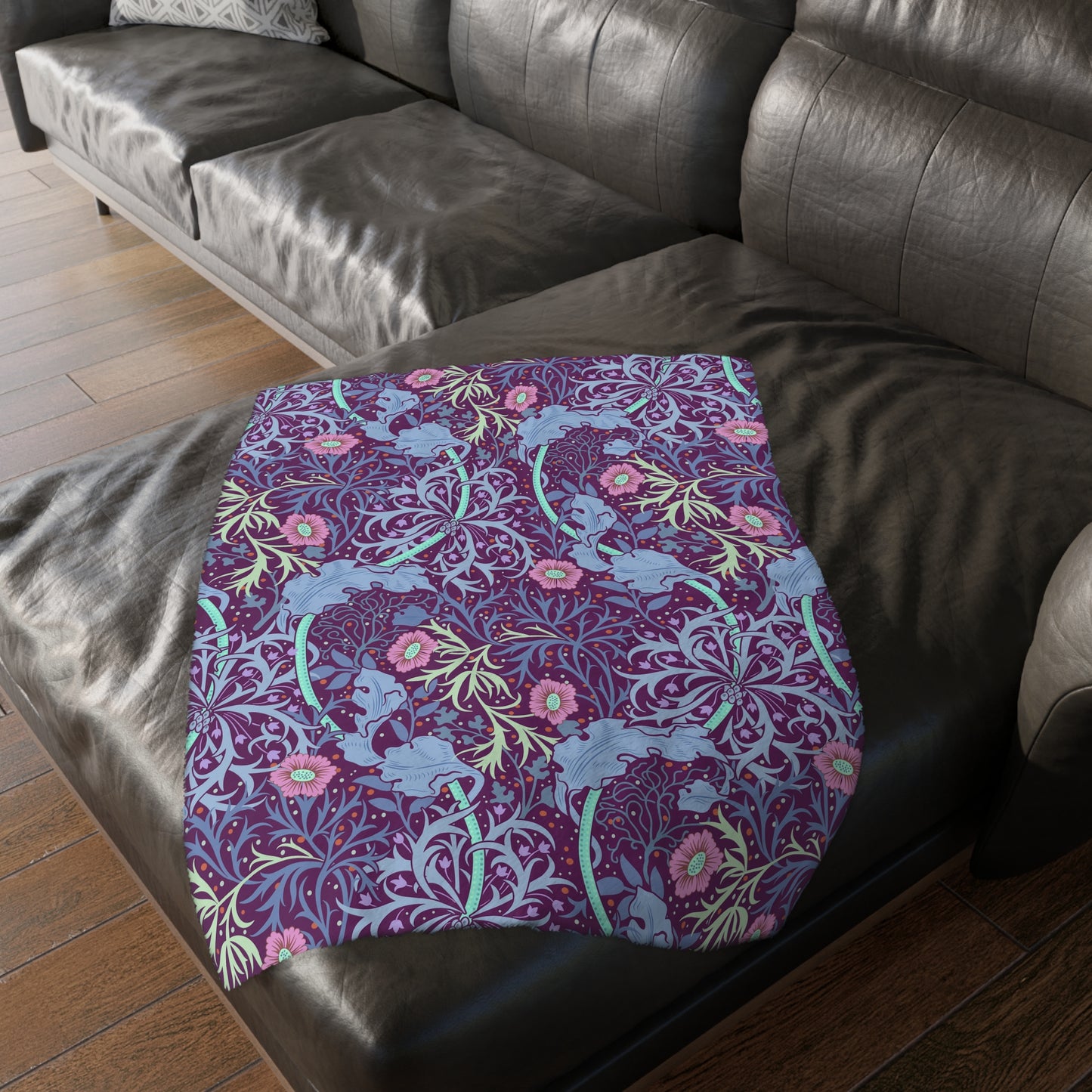 A Luxury Velveteen Minky Blanket with a two-sided print featuring a seaweed-inspired William Morris & Co floral pattern in blue, pink and purple tones.