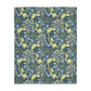 A Luxury Velveteen Minky Blanket with a two-sided print featuring a seaweed-inspired William Morris & Co floral pattern in blue, green and yellow tones.