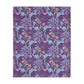 A Luxury Velveteen Minky Blanket with a two-sided print featuring a seaweed-inspired William Morris & Co floral pattern in blue, pink and purple tones.
