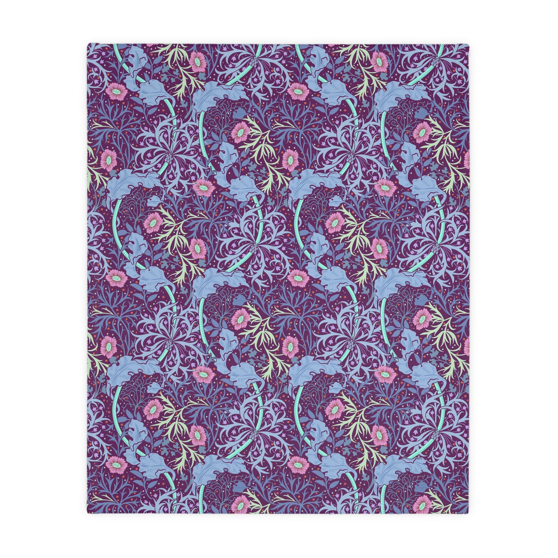 A Luxury Velveteen Minky Blanket with a two-sided print featuring a seaweed-inspired William Morris & Co floral pattern in blue, pink and purple tones.