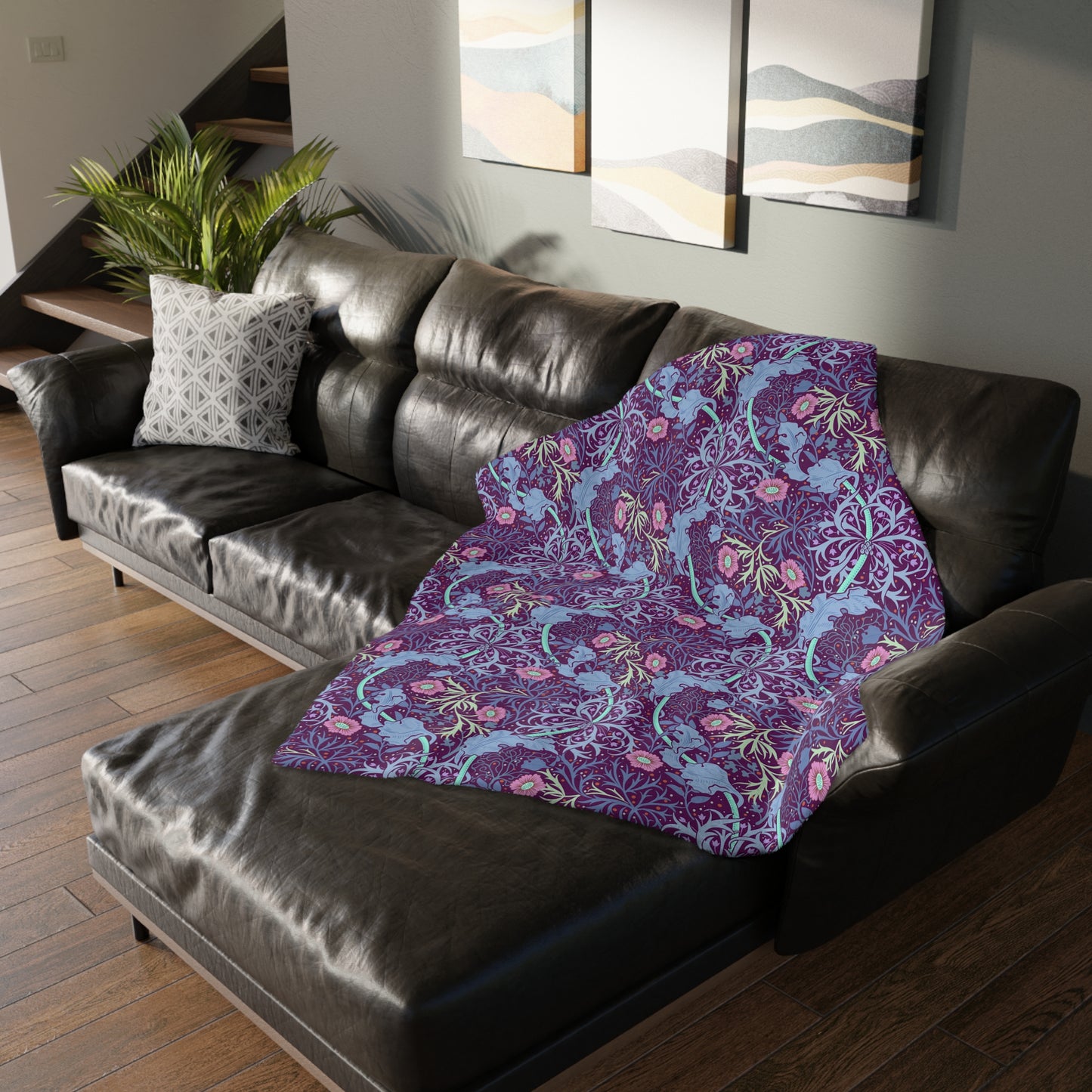 A Luxury Velveteen Minky Blanket with a two-sided print featuring a seaweed-inspired William Morris & Co floral pattern in blue, pink and purple tones.