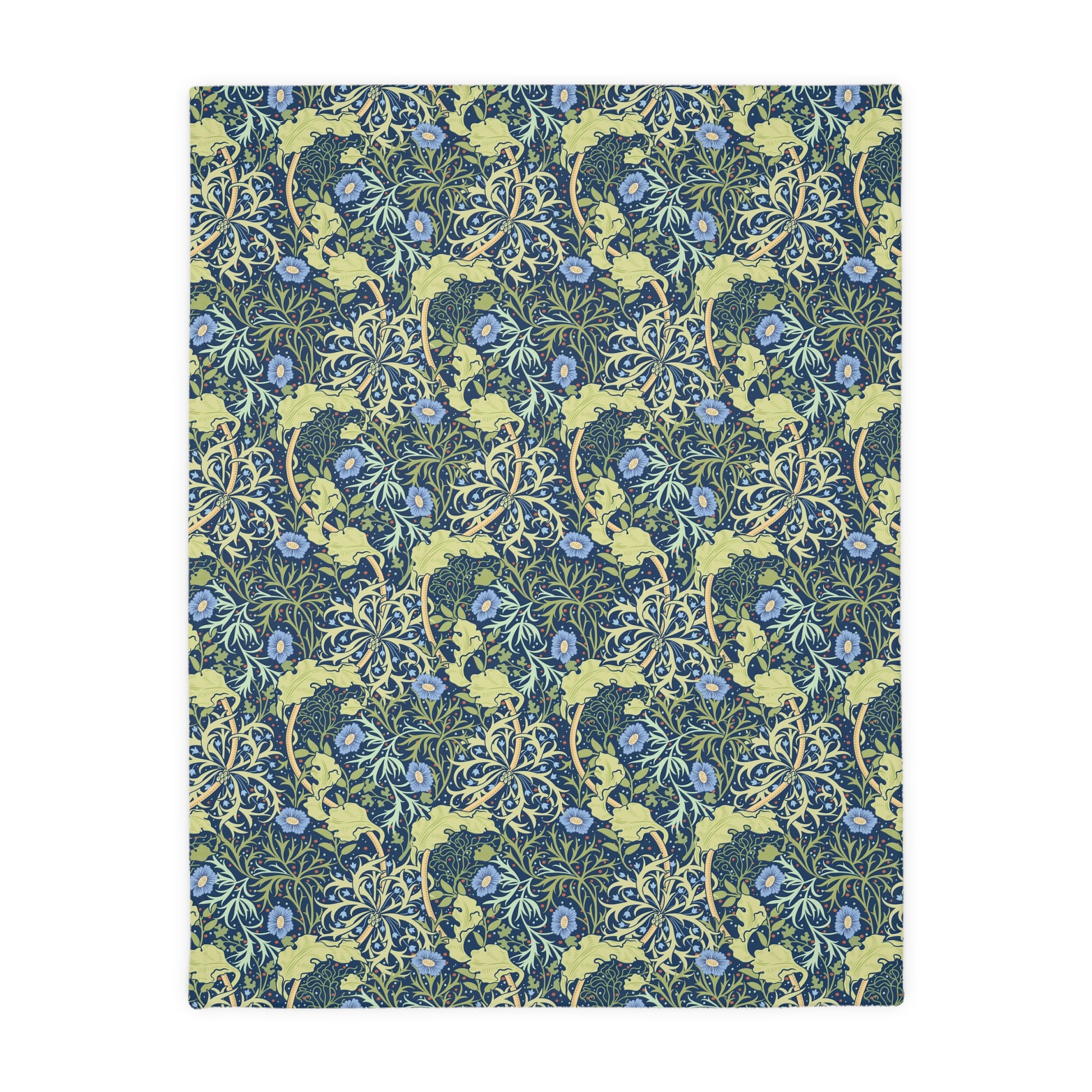 A Luxury Velveteen Minky Blanket with a two-sided print featuring a seaweed-inspired William Morris & Co floral pattern in blue, green and yellow tones.
