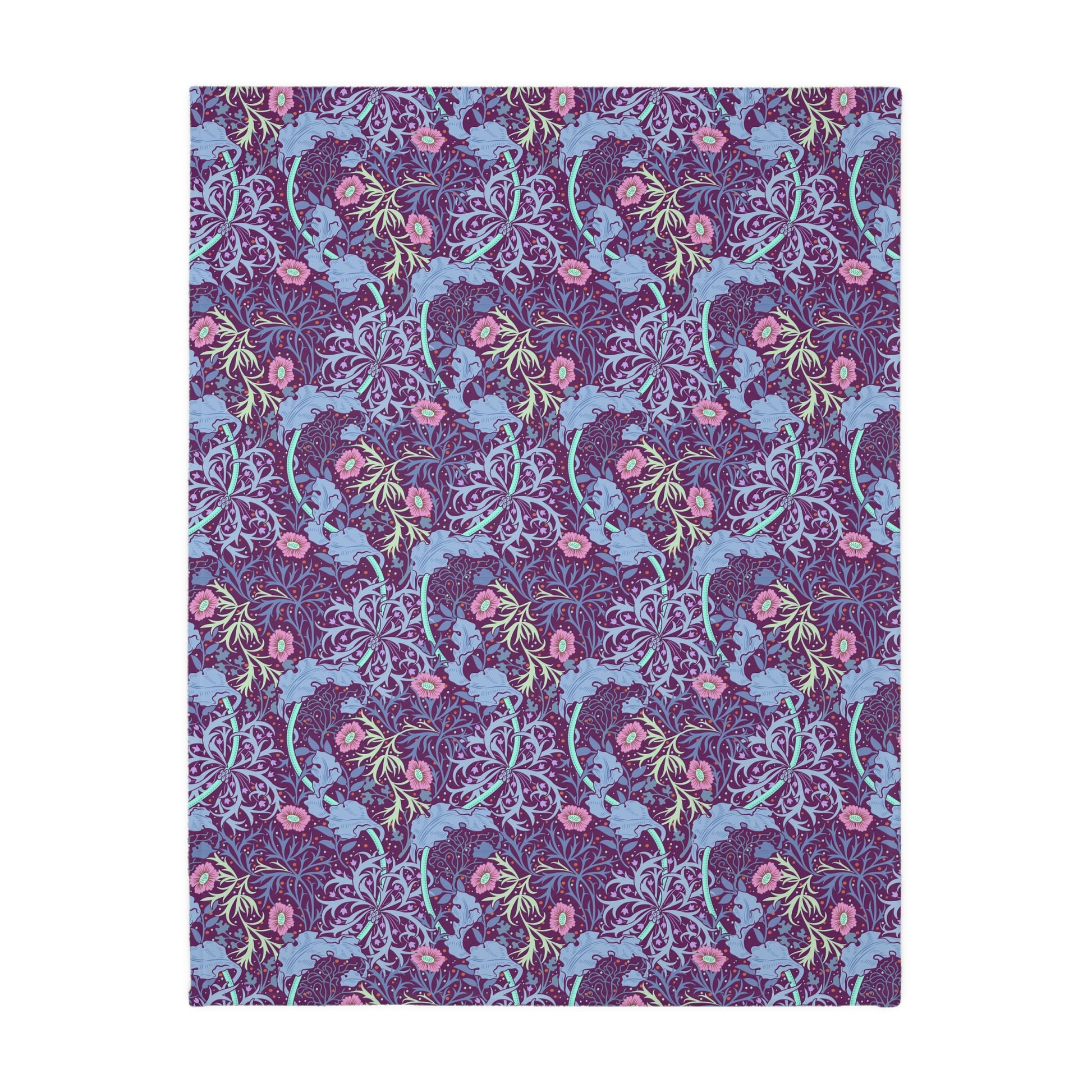 A Luxury Velveteen Minky Blanket with a two-sided print featuring a seaweed-inspired William Morris & Co floral pattern in blue, pink and purple tones.