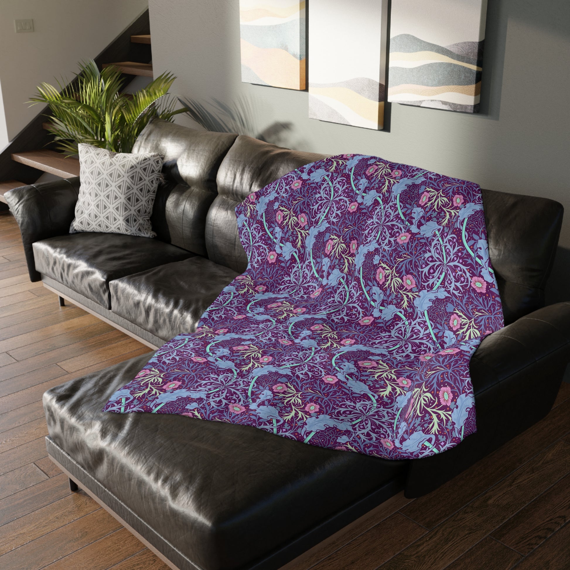 A Luxury Velveteen Minky Blanket with a two-sided print featuring a seaweed-inspired William Morris & Co floral pattern in blue, pink and purple tones.