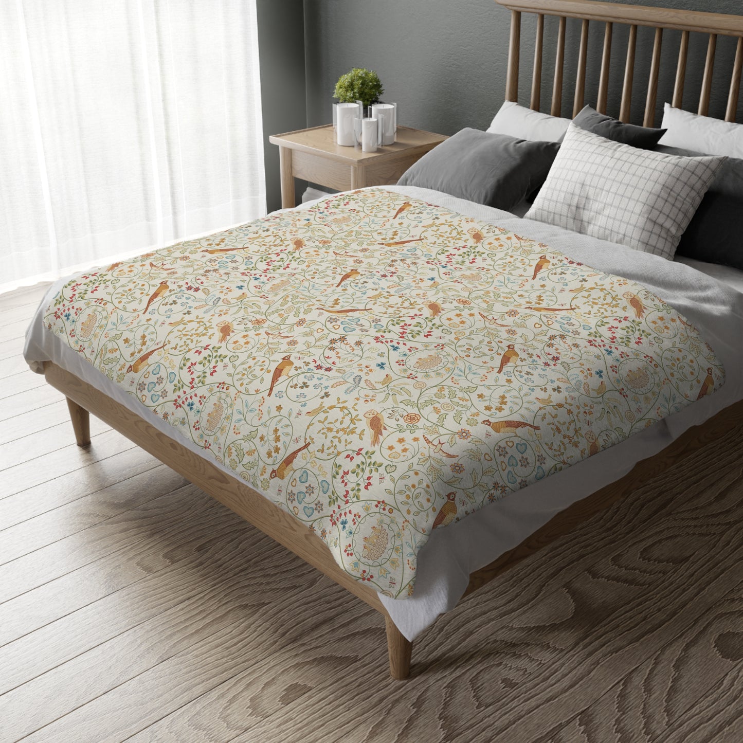 Bed with floral patterned duvet cover in a bedroom setting