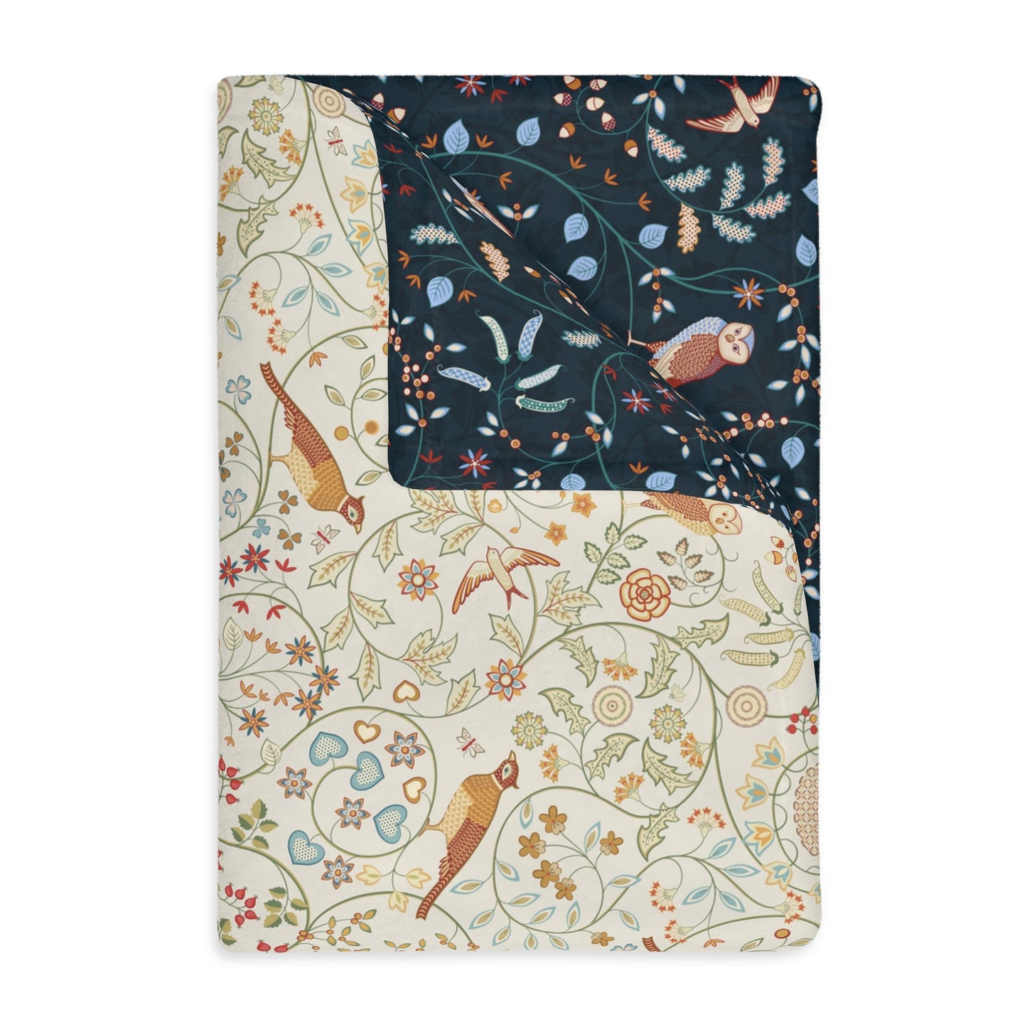 Two patterned blanket on a white background, one with birds and flowers, the other with a dark background with birds and leaves.