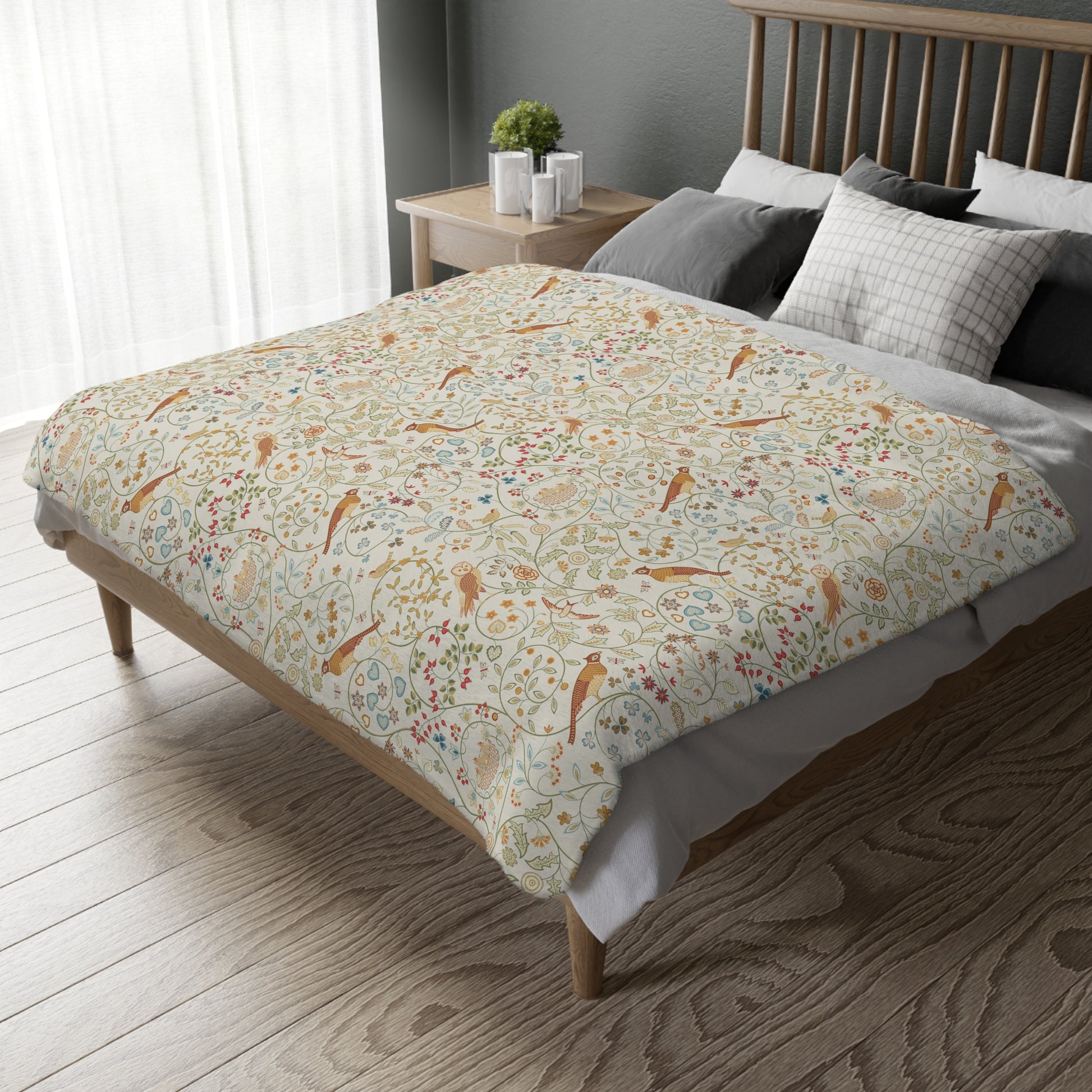 Bed with floral patterned duvet cover in a bedroom setting