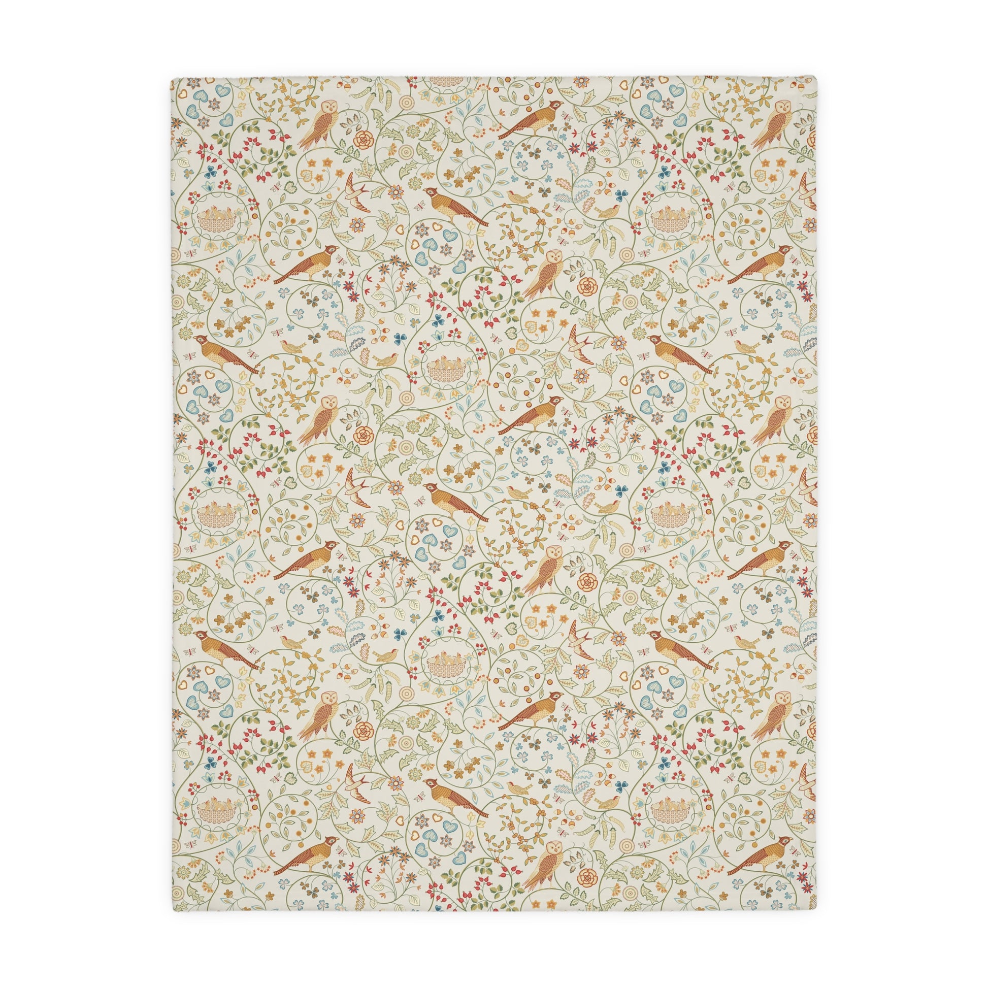 Patterned William Morris & Co blanket with birds and flowers on a white background