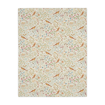 Patterned William Morris & Co blanket with birds and flowers on a white background
