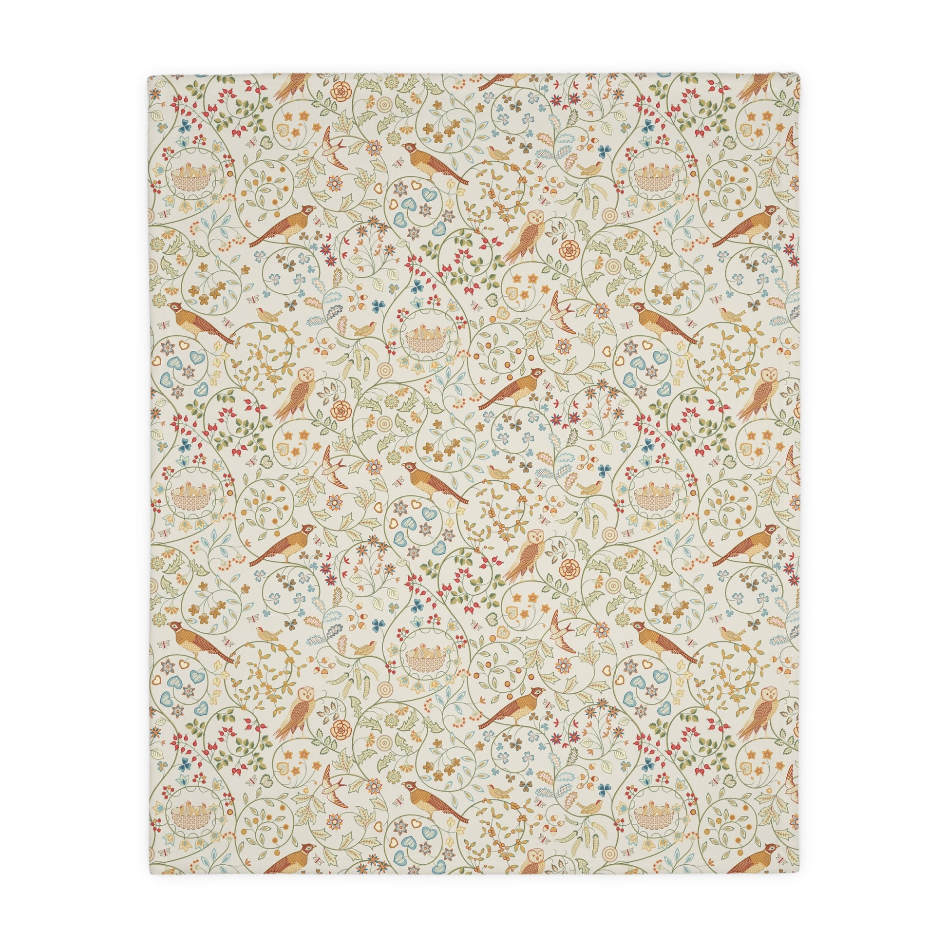 Patterned William Morris & Co blanket with birds and flowers on a white background
