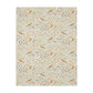 Floral and bird William Morris & Co patterned blanket on a white background