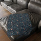 Patterned blanket on a dark brown leather sofa