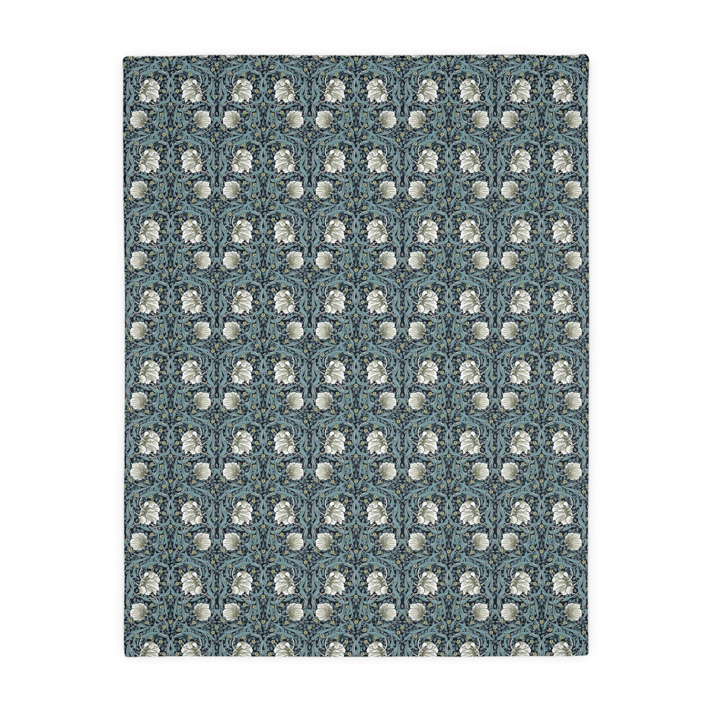 A rectangular blanket with a two-sided print featuring William Morris & Co floral patterns in shades of slate and green in a pattern called Pimpernel with a luxurious velveteen texture.