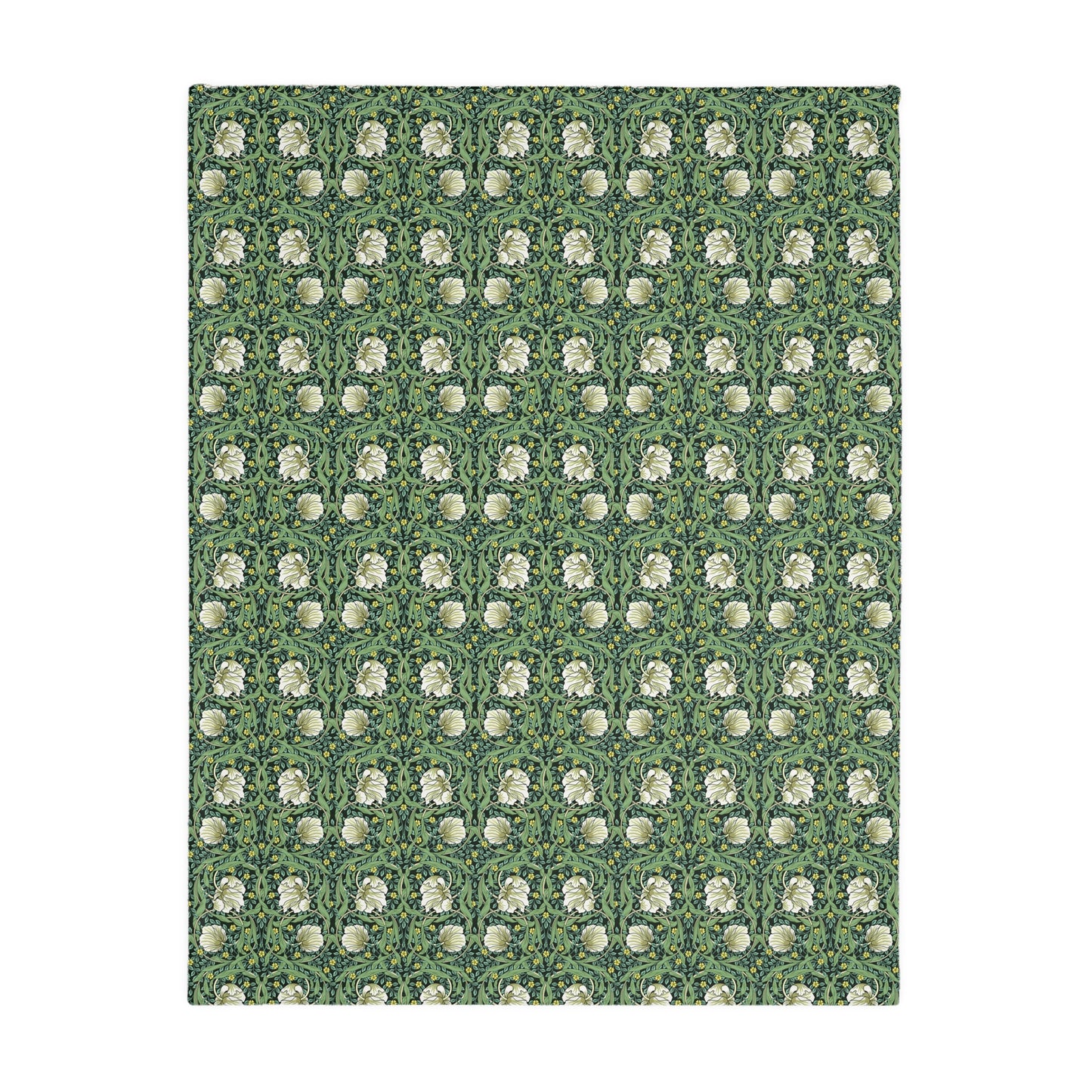 A rectangular blanket with a two-sided print featuring William Morris & Co floral patterns in shades of slate and green in a pattern called Pimpernel with a luxurious velveteen texture.