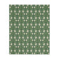 A rectangular blanket with a two-sided print featuring William Morris & Co floral patterns in shades of slate and green in a pattern called Pimpernel with a luxurious velveteen texture.