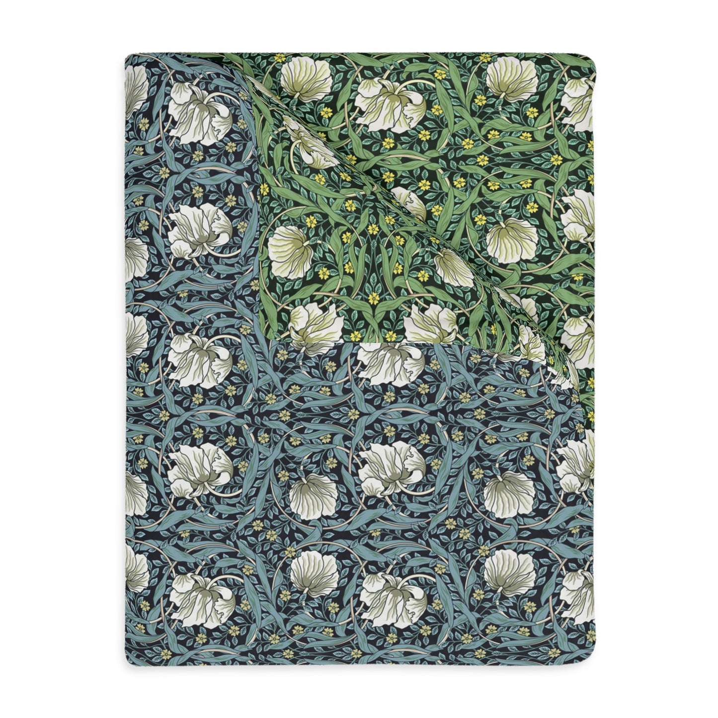 A rectangular blanket with a two-sided print featuring William Morris & Co floral patterns in shades of slate and green in a pattern called Pimpernel with a luxurious velveteen texture.