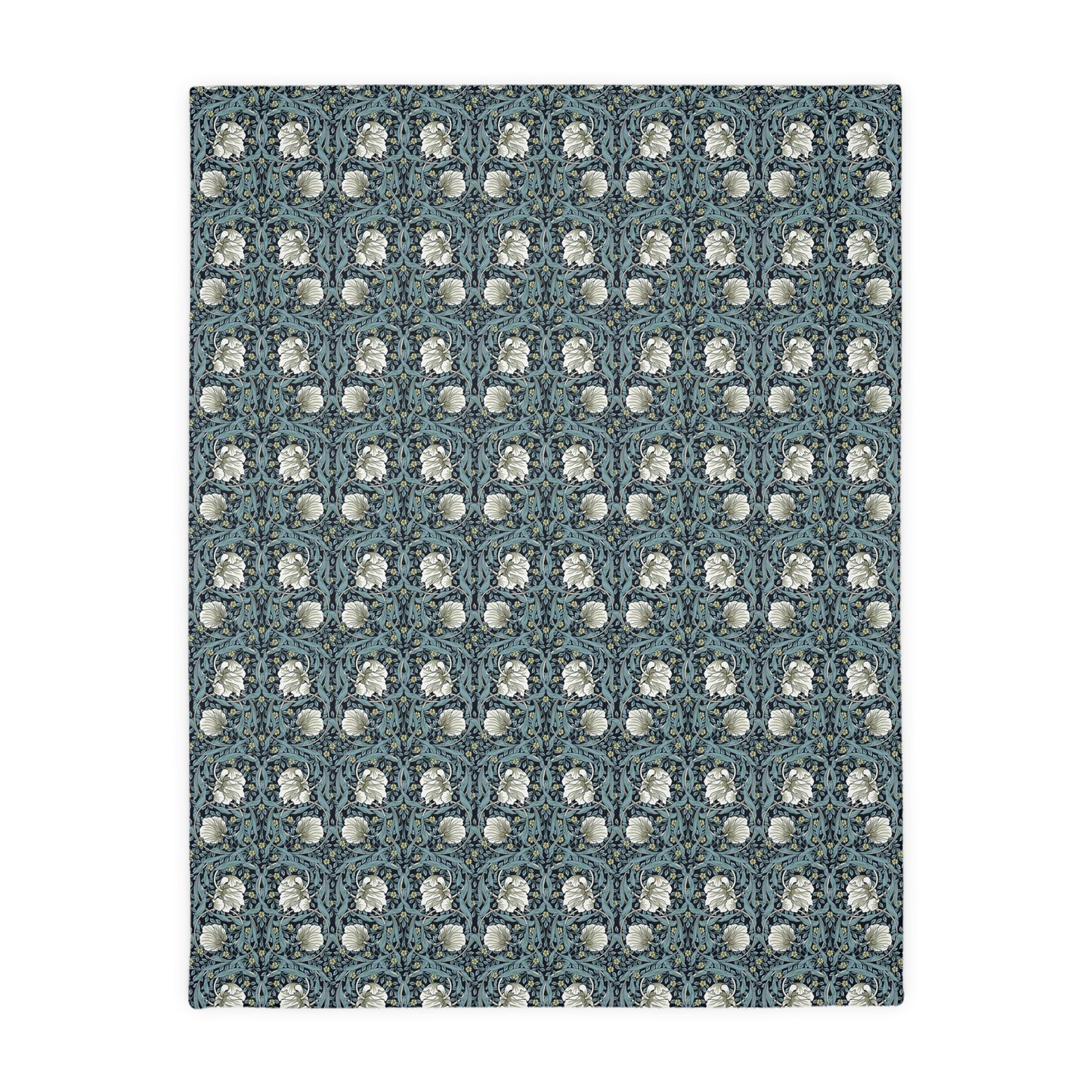 A rectangular blanket with a two-sided print featuring William Morris & Co floral patterns in shades of slate and green in a pattern called Pimpernel with a luxurious velveteen texture.