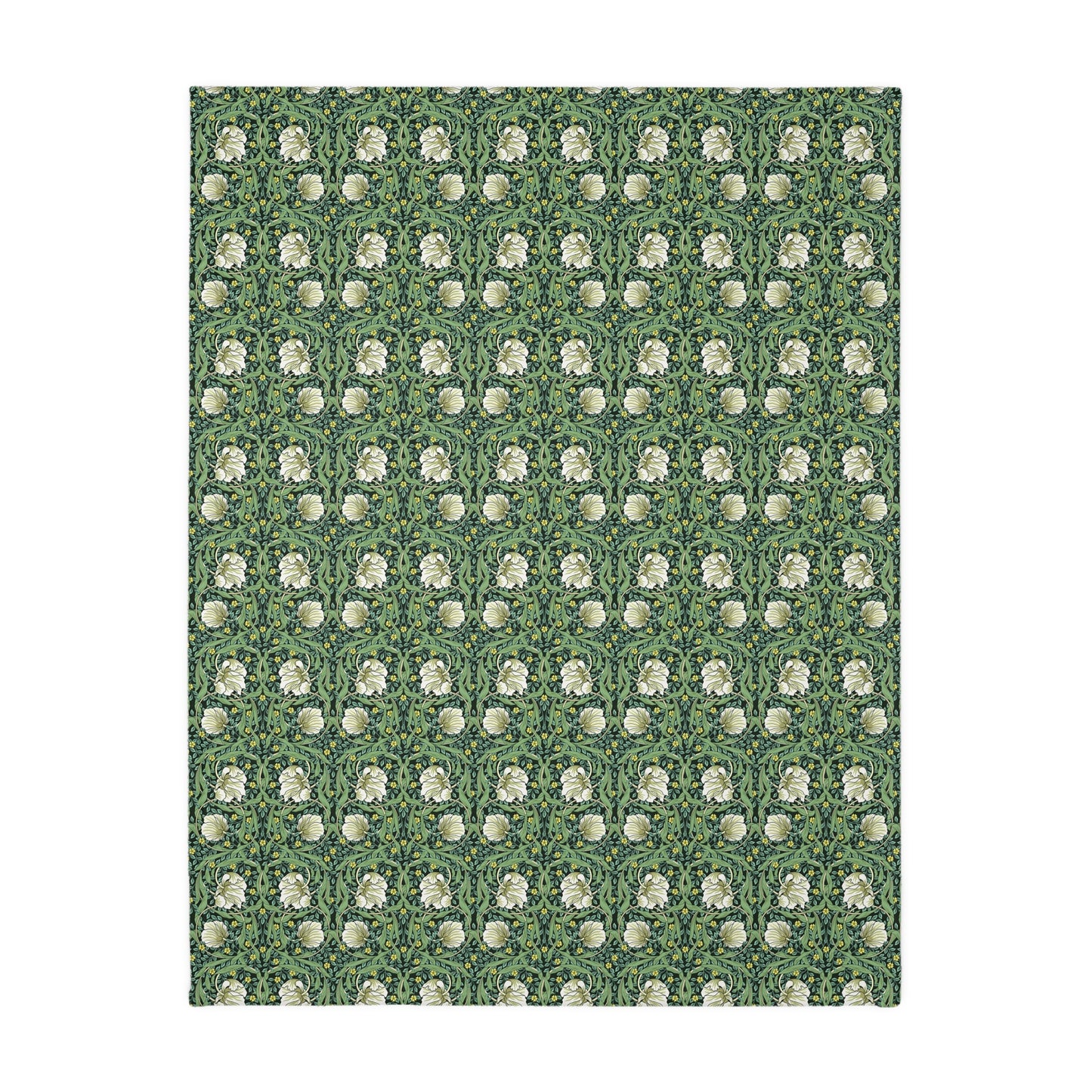 A rectangular blanket with a two-sided print featuring William Morris & Co floral patterns in shades of slate and green in a pattern called Pimpernel with a luxurious velveteen texture.