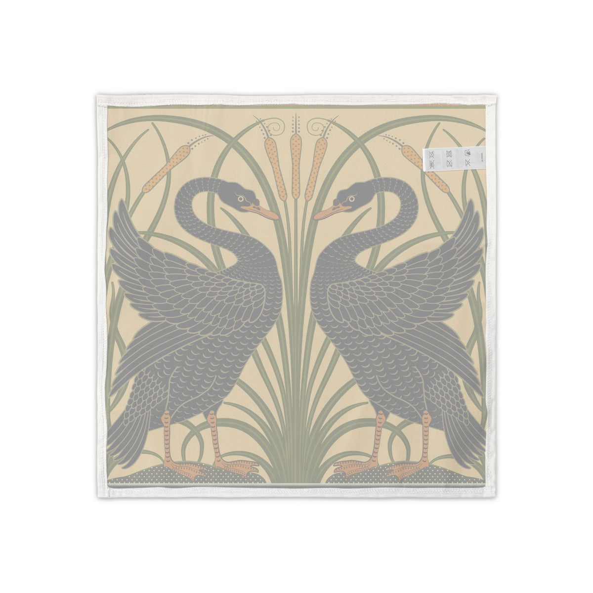 A square textile product, likely a napkin or small towel, featuring a vintage Art Nouveau design of two black swans facing each other in front of tall green reeds on a warm beige background.