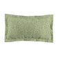 A green pillow sham with a floral pattern inspired by William Morris's classic designs.