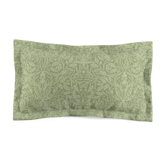 A green pillow sham with a floral pattern inspired by William Morris's classic designs.