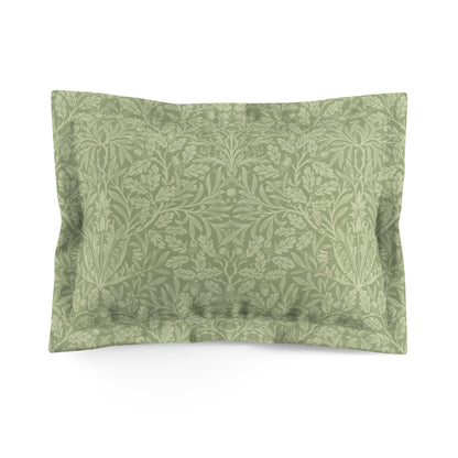 A green pillow sham with a floral pattern inspired by William Morris's classic designs.