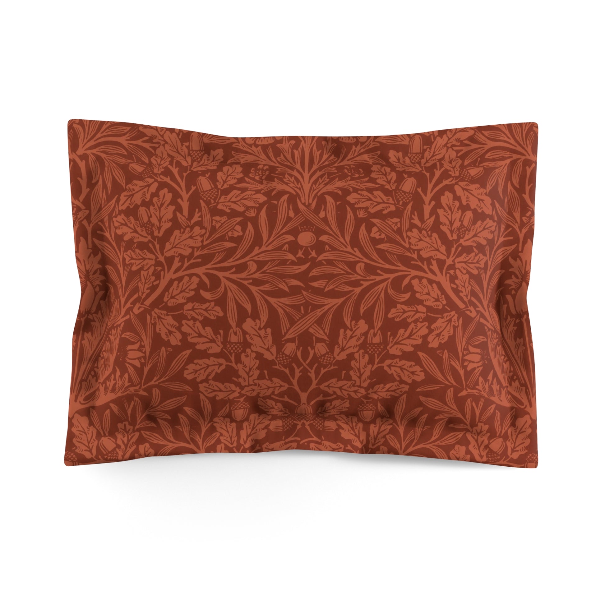 A rectangular pillow sham with a floral acorn and oak leaves design in a rust colour on a white background.