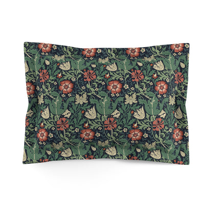 Pillow sham with a floral design inspired by William Morris, featuring a mix of green, red, and cream colours on a dark background.
