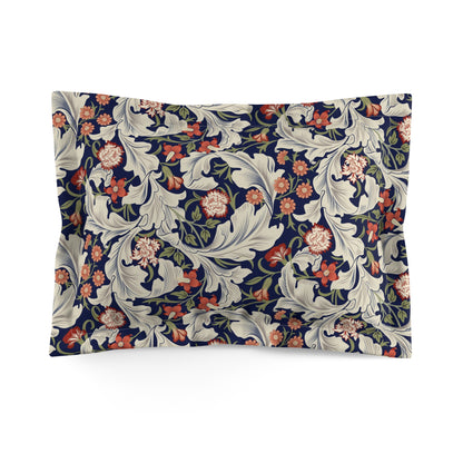 A square-shaped pillow sham with a floral pattern inspired by William Morris's classic designs, in a cream colour with red and blue accents.