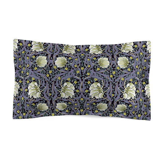 A rectangular pillow sham with a floral design inspired by William Morris in lavender and cream colors on a dark background.