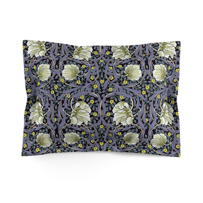 A rectangular pillow sham with a floral design inspired by William Morris in lavender and cream colours on a dark background.